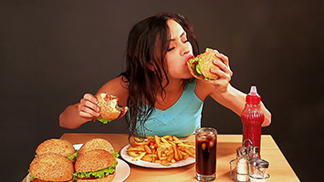stock-footage-woman-eating-fast-food-time-lapse